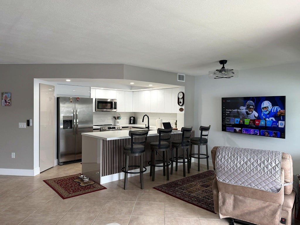 Photo of 13705 SW 12TH Street #311B, Pembroke Pines, FL 33027 (MLS # B26080182)
