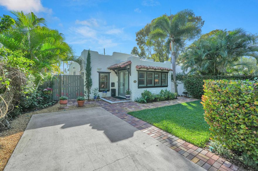 Step into Casa las Flores, an exquisite 1925 sanctuary that masterfully bridges the golden age of Florida architecture with sophisticated modern living. This Grandview Heights masterpiece captivates with its pecky cypress ceilings and trim, authentic rich hardwood flooring, secured by the peace of mind with a mix of impact windows and storm protection. Your lifestyle extends outdoors to a private, lushly landscaped oasis, yet the true luxury is the home's status as a pedestrian's paradise. Located just steps from the dog-friendly trails and tennis courts of Howard Park, you are perfectly positioned at the intersection of culture and convenience. From the high-end boutiques of The Square and the world-class performances at the Kravis Center to the fine art galleries of the Norton Museum, steps to City Place, every urban amenity is your backyard. Whether you're strolling the West Palm Beach waterfront or exploring the charm of nearby Flamingo Park and El Cid, 744 Penn Street offers an unparalleled "passport" to the most vibrant, walkable lifestyle in the Palm Beaches.