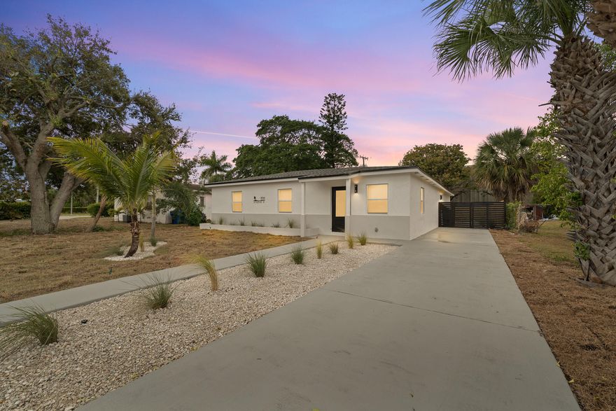 Completely renovated 3 bedroom, 2 bathroom home that lives like new construction. Every detail was redone, including a professional addition bringing total living space to 1,644 square feet. Open layout with a fully upgraded kitchen featuring new stainless steel appliances, sleek cabinetry, modern countertops, and contemporary lighting. Enjoy peace of mind with a brand new roof, impact resistant windows and doors, and all new electrical and plumbing. The oversized backyard offers nearly 90 feet of depth, one of the largest in the neighborhood, with endless possibilities. Located less than a mile from the water with easy access to marinas, Peanut Island, Singer Island beaches, dining, and major roadways. Riviera Beach is rapidly growing, making this a prime turnkey opportunity.