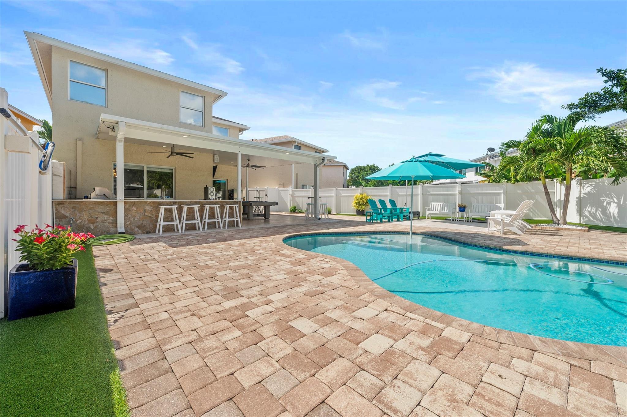 Discover this stunning 4-beds, 2.5-bath single-family home in the Eastridge community. Fully remodeled & move-in ready, the home showcases a sleek modern kitchen with top-of-the-line black stainless-steel appliances, a full pantry. The living room features an accent wall, bar, and coffee bar while all 4 bedrooms offer large closets.
Freshly painted inside, a brand-new water heater & a new roof. Downstairs you’ll find all impact windows, plus in two bedrooms. The 2-car garage includes storage, & the 4-car driveway provides plenty of parking.
Step outside to your private backyard oasis, great for entertaining, with an exterior kitchen, high-end ice maker and grill, shower, bathroom, sparkling pool and backyard lighting. No grass maintenance as all artificial grass. Fast approval.