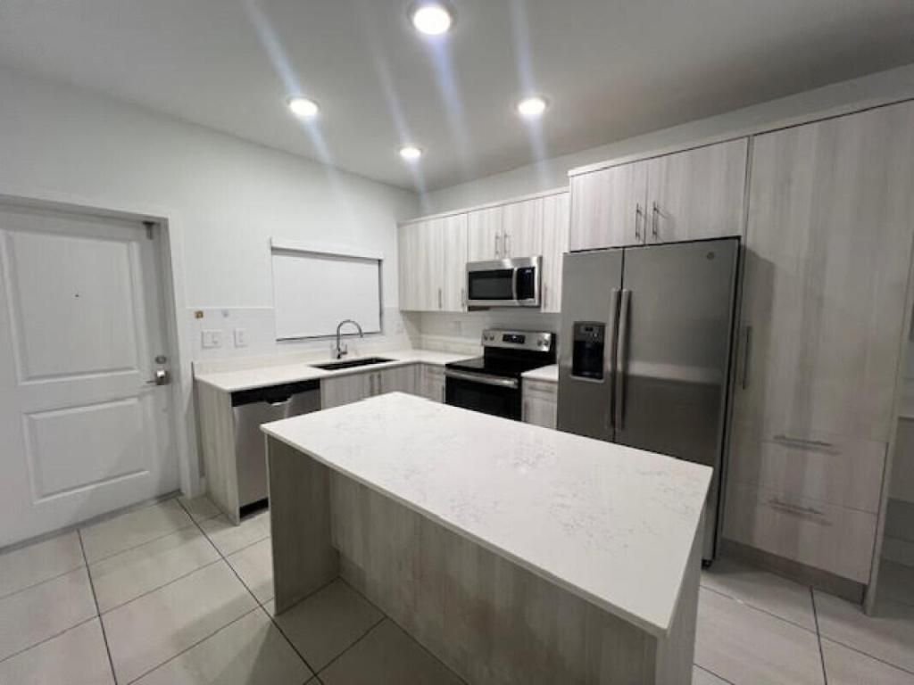 Photo of 3884 Melaleuca Lane, Lake Worth, FL 33461 (MLS # R11155274)