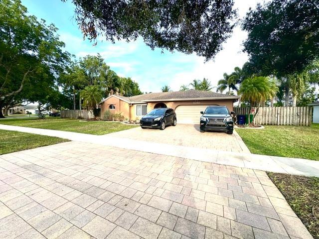 Live the “Someplace Special” lifestyle in Cooper City’s Flamingo Gardens! This bright and spacious 3BR/2BA single-story home offers about 2,000 sq ft of living space on a generous 1/3-acre waterfront lot. Built in 1984, it features an updated open-concept kitchen, a large paved patio, and a sparkling pool with a removable child safety fence. The fully fenced backyard opens to the lake—perfect for relaxing, fishing, pets, or weekend BBQs. Families love this neighborhood for its A-rated schools, lush green spaces, and unbeatable location close to parks, shopping, and top-tier amenities. Monthly pool and lawn maintenance + pest control included in rent! Pets welcome with approval. Some furniture negotiable. Make this move-in ready home your own and enjoy the best of Cooper City living!