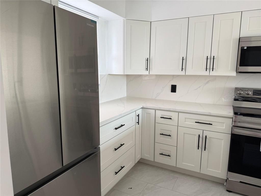 Photo of 112 Royal Park Drive #4b, Oakland Park, FL 33309 (MLS # B26024010)