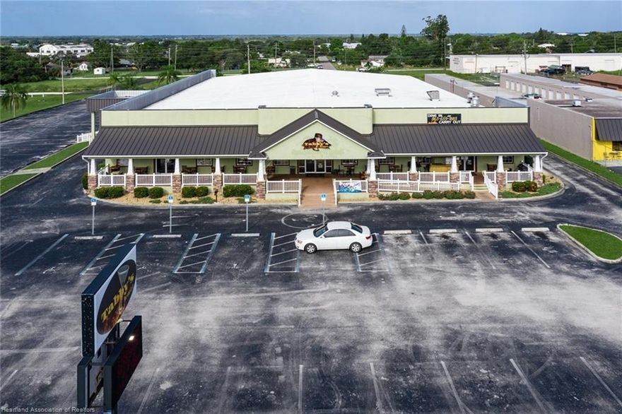 Prime 22,000 SF Retail Bldg in Lake Placid. Median turn into site across from other franchise retailers. Front 7000 sf currently leased for restaurant/bar. Rear 15,000 sf space is clear span and was the bowling alley now currently used by owners to store / sell automobiles/ motor cyles. This space is climate controlled and separately fenced. Ideal mixed use bld. perfect for many alternative uses: Auto sales such as cars, motorcyles(Harley Davidson), RV's, Boats,etc. Do not disturb the Restaurant Tenant! Appointment ONLY!