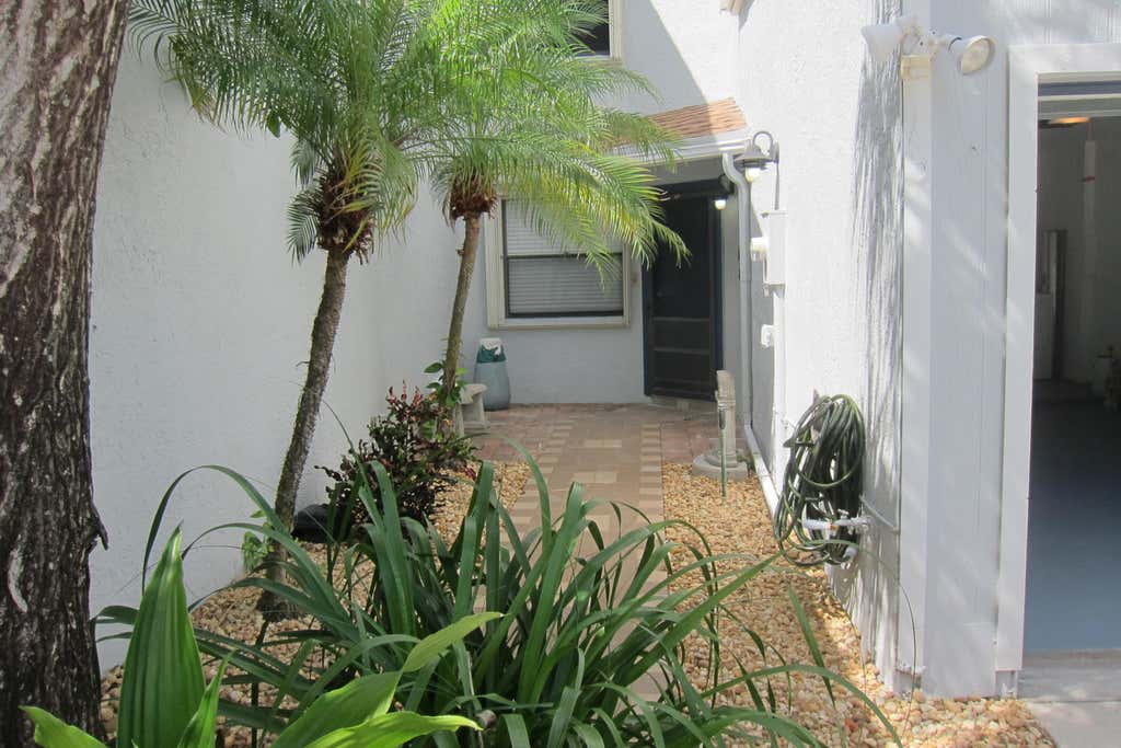 Photo of 1517 Woodbridge Lakes Circle, West Palm Beach, FL 33406 (MLS # B26063845)