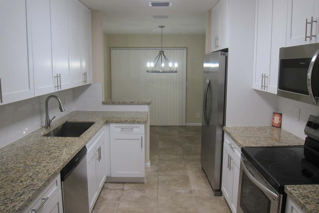 Photo of 1517 Woodbridge Lakes Circle, West Palm Beach, FL 33406 (MLS # B26063845)