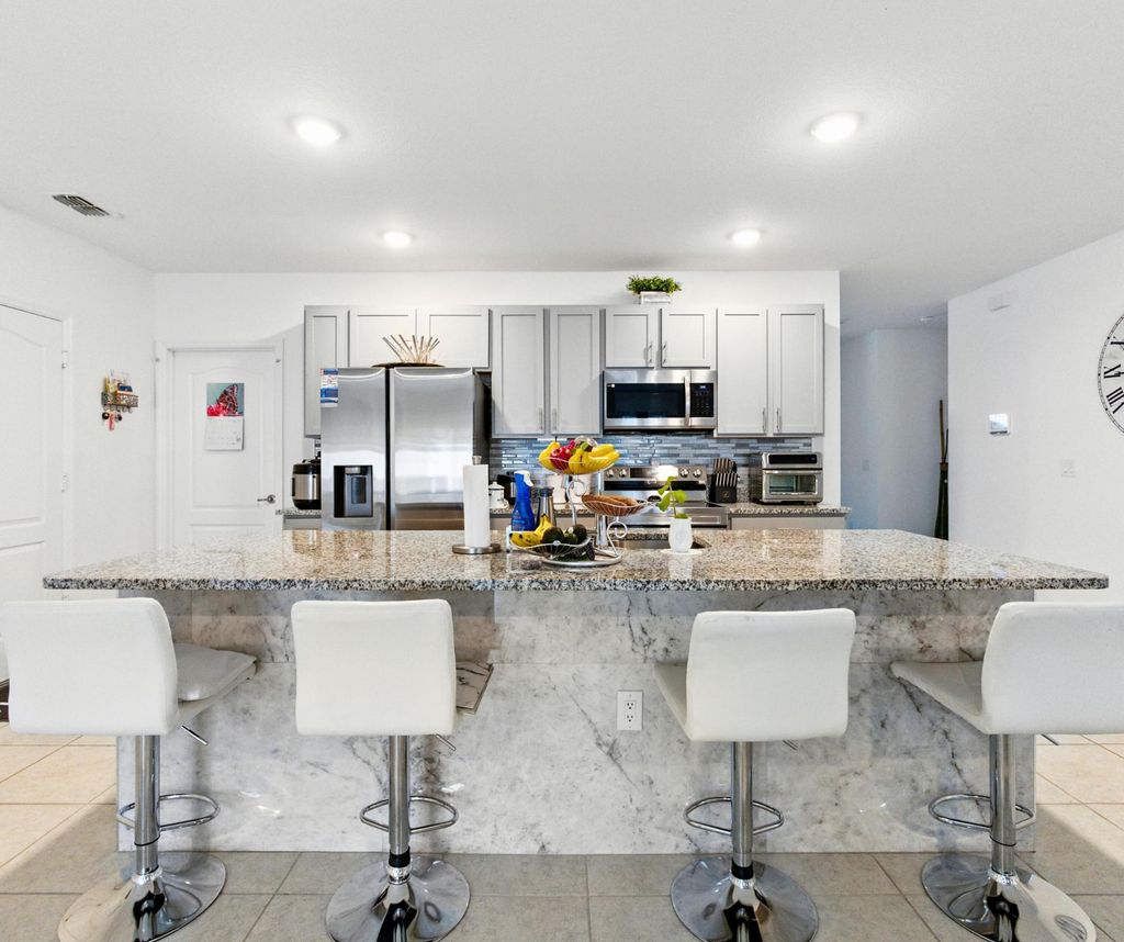 Photo of 3020 SW Ann Arbor Road, Port Saint Lucie, FL 34953 (MLS # B26006297)