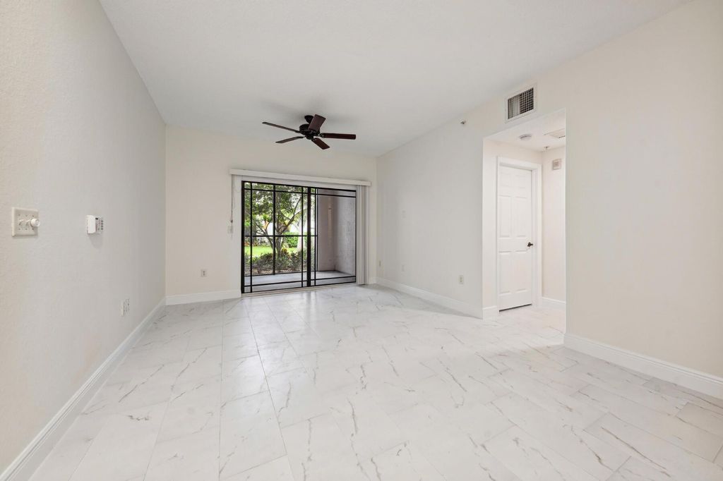 Photo of 3021 Alcazar 104 Place #104, Palm Beach Gardens, FL 33410 (MLS # R11092551)