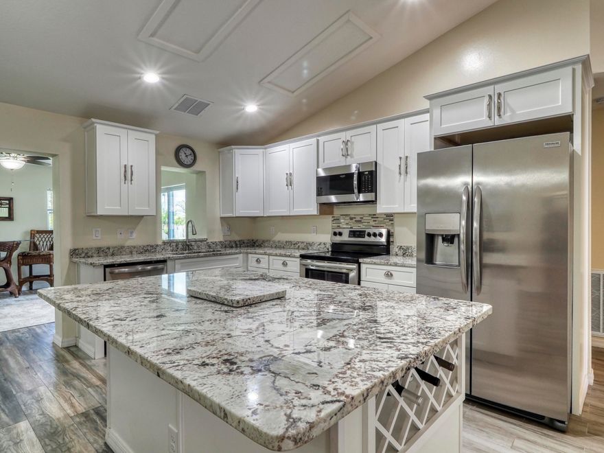 Beautifully completely remodeled home with a spacious floor plan, elegance throughout the house with a new kitchen stainless appliances and granite countertops, Solid wood cabinets, new baths, flooring-vinyl plank and tile, roof, upgraded lighting & hardware, gutters additional Florida room added has impact windows along with an open patio with a spectacular 10X10 Pergola with a sun sail canopies great for your morning coffee or for entertaining.There's plenty of room for a pool fully fenced private yard with lovely landscaping.AC is only 3 years old.This is a beautiful property surrounded by newer homes, and situated in a quiet neighborhood near Becker Rd.The house is between the Turnpike and I-95 quick Highway access, nearby shops, schools and hospitals.This is a must-see don't miss out