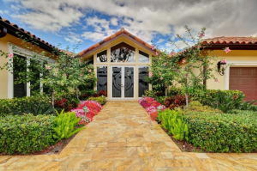 Single story waterfront residence on the Buccaneer Palm Waterway with a private dock, in the prestigious Royal Palm Yacht & Country Club. Home has 4 bedrooms plus office, 4 1/2 baths, and 4,863 sqft under air.  Features include volume ceilings, impact glass windows and doors, split bedroom floorplan, formal living and dining rooms, marble flooring throughout main living areas, gourmet kitchen with top-of-the-line appliances and breakfast area. Spacious master suite has a sitting area, French doors leading to patio area, oversized walk-in closet, and a master bathroom with his and her vanity areas, private water closets, walk-in shower and separate jetted tub.