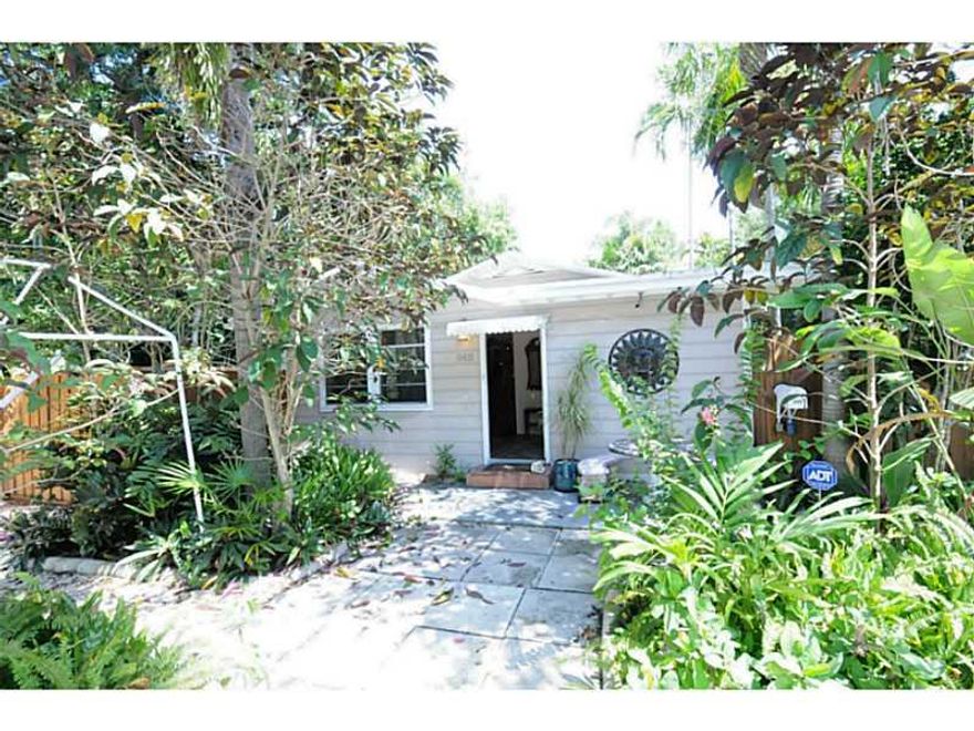 Beautiful Riverside Home w/Fireplace and  a lovely Cottage currently rented. Tenant helps maintain gardens and upkeep.  Main house is 1,224 sqft and cottage is 483 sqft.  Amazing tropical foliage and a nice screen enclosed porch  to enjoy it.   Both homes  have been well maintained and this is a great investment-current tenant is willing to stay in cottage.