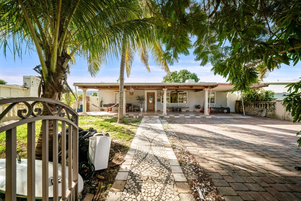 Photo of 1020 FOREST Court, West Palm Beach, FL 33405 (MLS # B26088905)