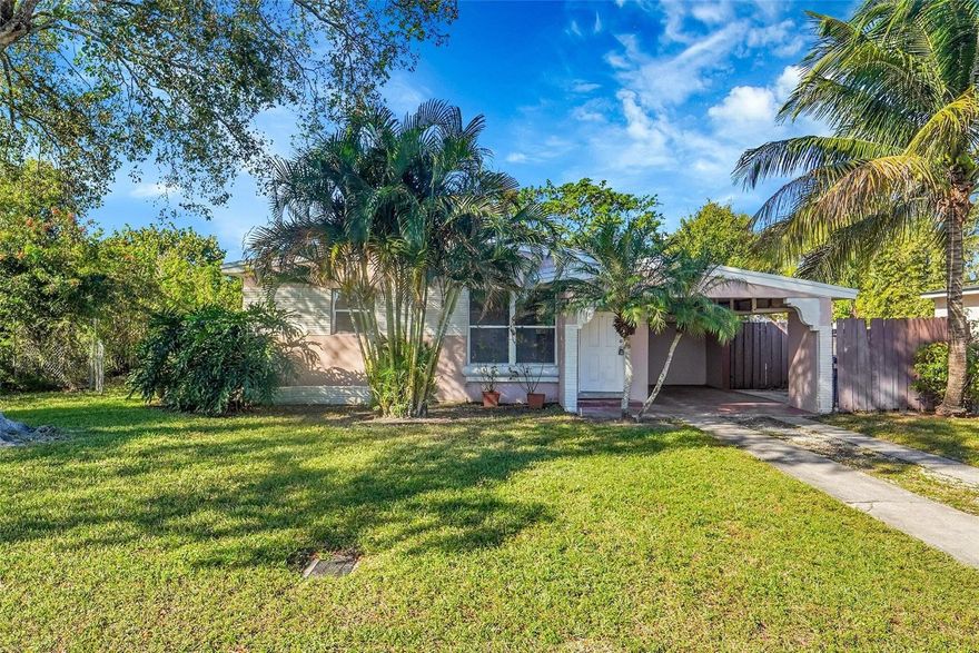 Welcome home to this charming 3-bedroom, 1.5-bath residence in the heart of Fort Lauderdale. Thoughtfully updated and move-in ready, this home features a newer roof (2024), tile flooring throughout, and an inviting, cozy kitchen with updated finishes—perfect for everyday living and casual entertaining. Both the kitchen and bathrooms have been tastefully updated, offering a fresh and comfortable feel. A full-size washer and dryer add everyday convenience, while the one-car carport provides covered parking. Step outside to a large fenced yard, ideal for outdoor entertaining, pets, or future expansion. Located in a great central location, this home offers easy access to shopping, dining, major roadways, and all that Fort Lauderdale has to offer.