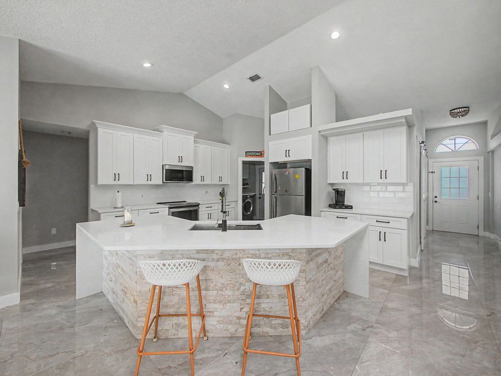 Photo of 1573 SW Aledo Lane, Port Saint Lucie, FL 34953 (MLS # B26025102)