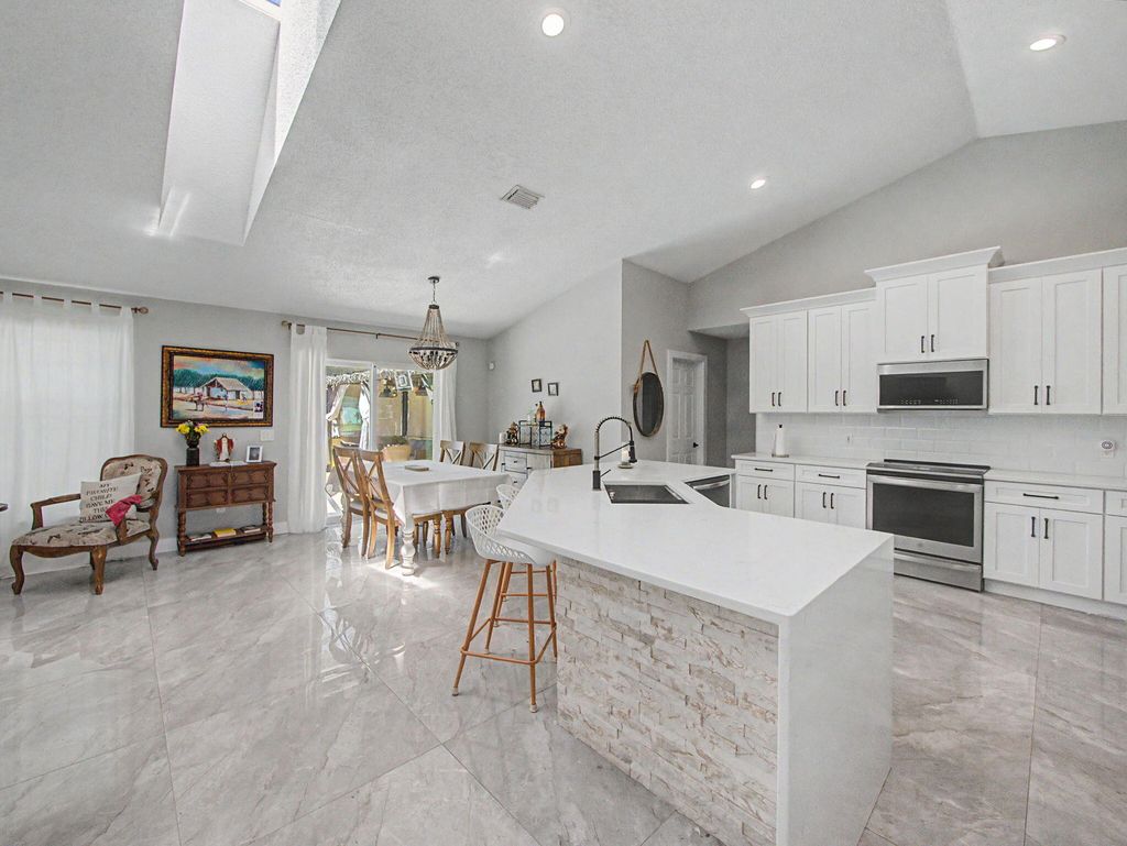 Photo of 1573 SW Aledo Lane, Port Saint Lucie, FL 34953 (MLS # B26025102)