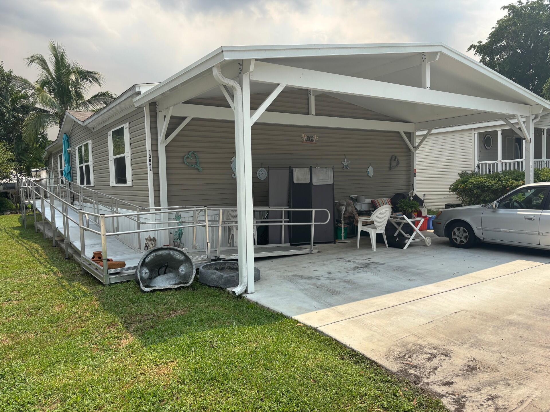 DON'T MISS THE OPPORTUNITY TO SEE THIS BEAUTIFUL, SPACIOUNS AND WELL MAINTAINED MANUFACTURED HOME WITH 3 BEDROOMS, 2 BATH'S. LOCATED ON CHERON VILLAGE, A NO AGE RESTRICTION COMMUNITY AND ONLY A FEW MILES FROM AREA BEACHES, WALKING DISTANCE FROM ELEMENTARY AND HIGH SCHOOL. HOME HAS HURRICANE RESISTANCE UP TO CODE WITH STORM IMPACT WINDOWS AND IT WITHSTANDS WINDS UP TO 165 MILES PER HOUR. NOT IN FLOOD ZONE.COME SEE IT TODAY! IT WON'T LAST. LOT RENTAL $1,208 MONTHLY. $50 DISCOUNT IF PAID BEFORE THE FIRST OF EACH MONTH.