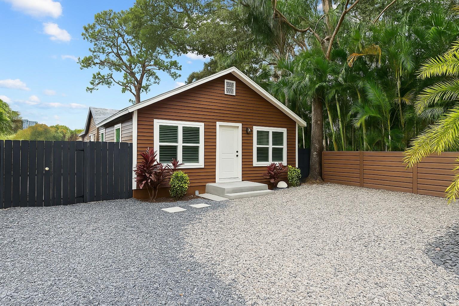 A rare find in the heart of Sailboat Bend’s historic district! This fully rebuilt 2 bed, 2 bath single family home was taken down to the studs and completely reconstructed in 2020—everything from the foundation to the roof is new. The bright, open-concept layout features impact windows and doors with charming Bahama shutters, durable laminate flooring throughout, and a contemporary kitchen with solid surface countertops and stainless steel appliances. Enjoy instant hot water, a new AC system with upgraded attic ductwork, and a spacious carport. The fully turfed backyard offers low-maintenance living and is perfect for pets, entertaining, or relaxing under the palms. With NO HOA - this home is an excellent investment or move-in-ready opportunity.