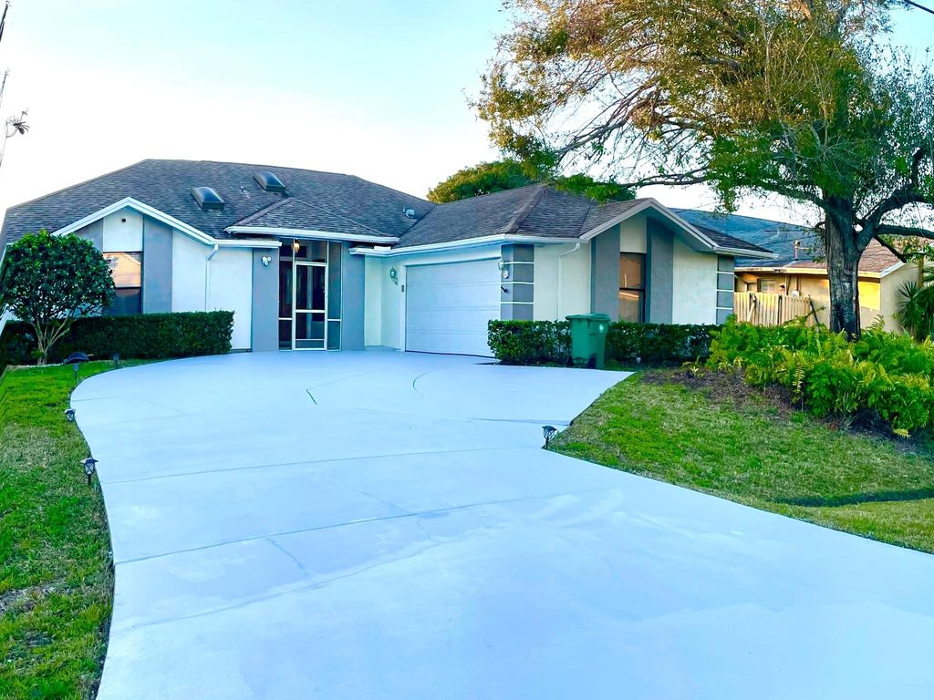 Photo of 5400 NW Emblem Street, Port St Lucie, FL 34983 (MLS # R10859963)