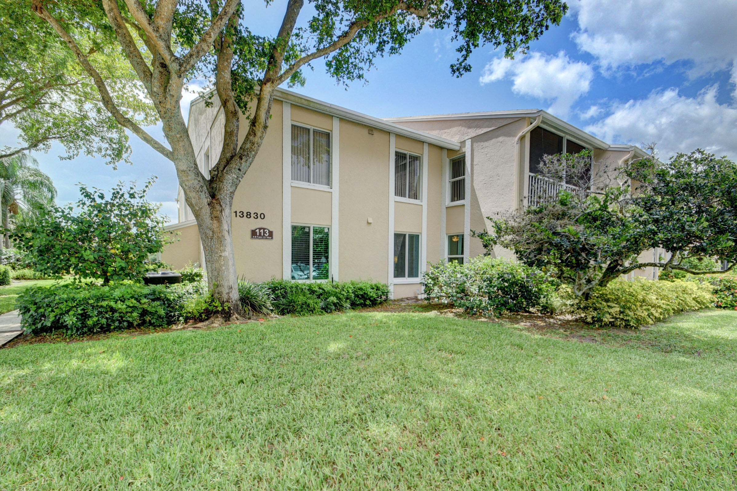 Move-In Ready! 1st floor, corner unit. 2 bedrooms, 2 bathrooms, approximately 1,086 square feet. New open kitchen with quartz countertop island with expanded cabinet space and stainless steel Samsung appliances. Bathrooms have been recently updated as well. Unit has a laundry room with full size washer/dryer in unit. Popcorn ceilings have been removed and redone. Screened balcony. Brand NEW impact windows throughout. Receive the benefit of it being a corner unit with additional side windows and natural light. Community offers quiet living, well maintained grounds with a lake, access to pool, tennis courts, and pickle ball. Easy access to Turnpike, less than 5 miles to I-95, 5 miles from all that Atlantic Ave has to offer as well as plenty of shops and restaurants close by. Act Fast!