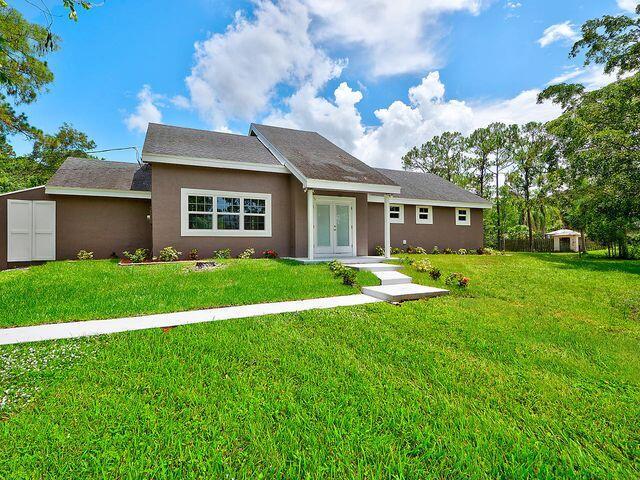 Beautiful 3-bedroom 2-bath home located in the private community of Loxahatchee. This home has a large eat-in kitchen equipped with stainless steel appliances and plenty cabinetry. Home has a second story loft which can be converted into a 4th bedroom. The spacious living room leads to the back porch overlooking 1.14 acre lot. Perfect for families! Seller motivated!