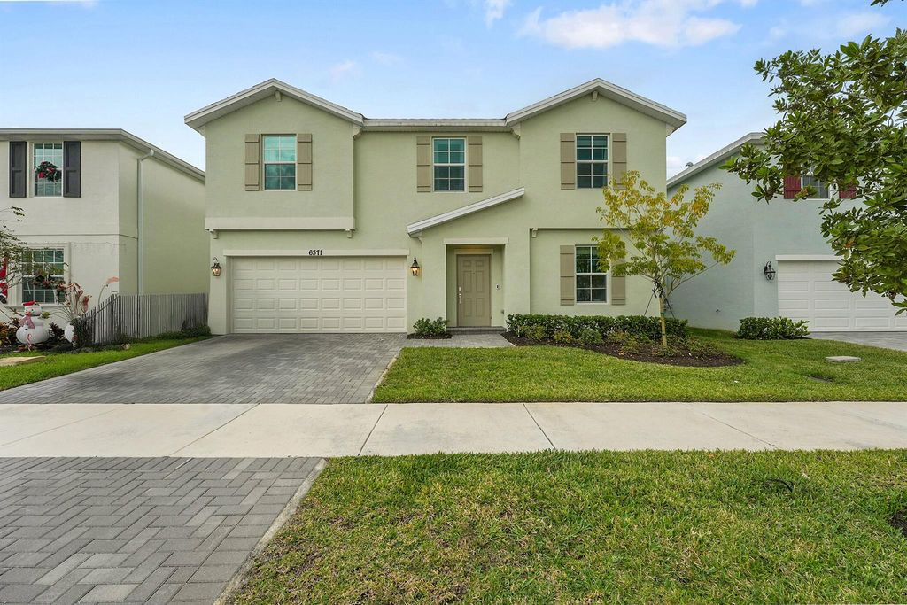 Photo of 6371 NW Windwood Way, Port Saint Lucie, FL 34987 (MLS # R11144332)