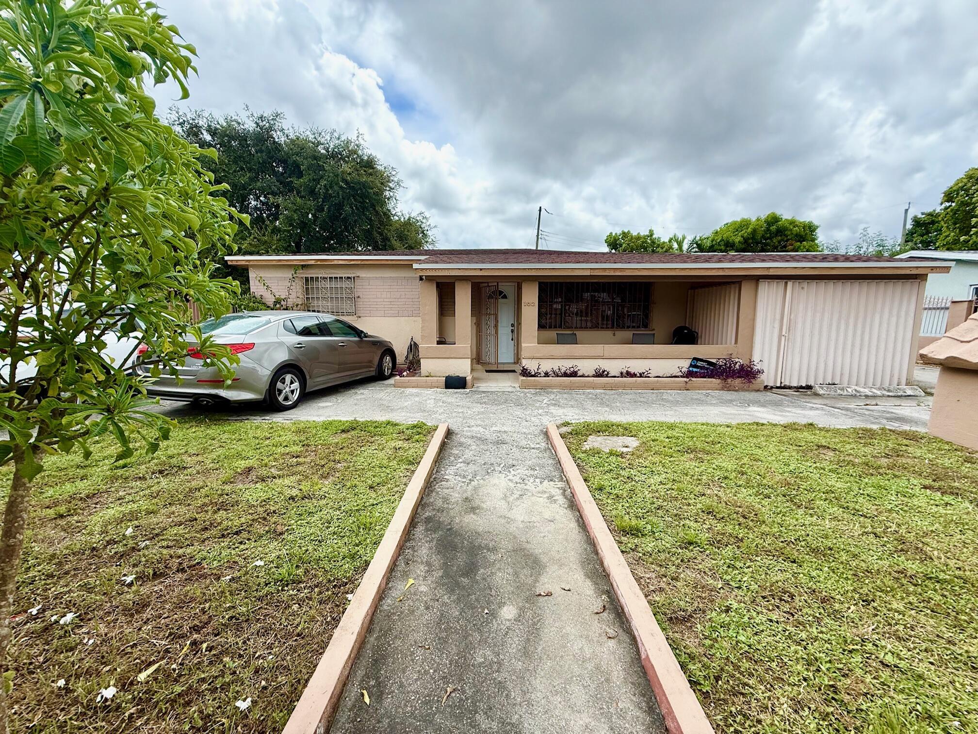 Welcome to this Investor Special or Multi-Generational Gem in the Heart of Hialeah! This Single Family Home offers endless opportunities with a current layout featuring 3 bedrooms and 1 bath in the Main House, and an additional 3 Efficiencies each with 1 bedroom, 1 bath. Currently 2 out of the 3 have kitchenettes. Great space for an in-law suite, home office, or even an Airbnb.Roof and Electrical Panel have both been updated. This property is situated on a large lot with fruit trees, a large driveway and a current enclosure that can be used as a one car garage. The sky's the limit with this property! Whether you're an investor seeking strong rental returns or a homeowner needing more living space, this home checks off all the boxes.