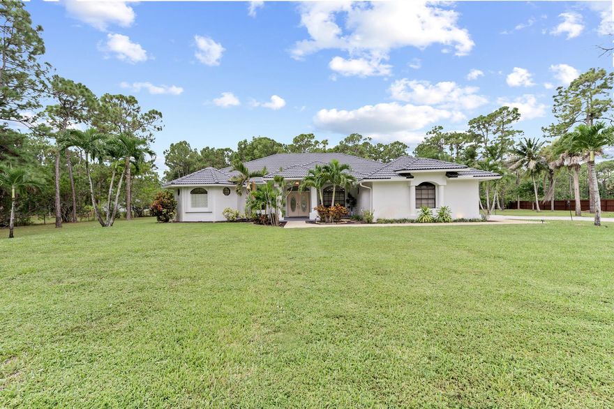 This beautifully 2025 fully renovated gem sits on a premium 1.80 acre lot and boasting 4 bedrooms, 3 baths, to include an in-law suite and 2 car garage, with ample parking for multiple vehicles to include a boat, RV. The house has complete accordion shutters and full house generator and shed with electric.  AC 2024, hot water heater 2024.Tesla charging stations and Telsa solar panels. The property is beautiful fully fenced corner lot. A covered entry brings you inside the custom etched front door where you are greeted by soaring 12' volume ceilings, spacious foyer, abundance of natural lighting and overlooking the spacious private yard.The renovations and high-end finishes are too numerous to mention--a MUST SEE!!!!