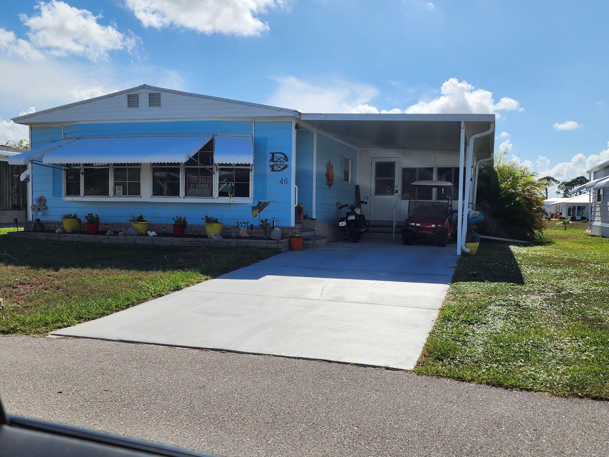 Move-in ready and fully upgraded! Check out this beautiful LAKEFRONT 2 BED 2 BATH Double-wide! Featuring a newer METAL ROOF! Enjoy luxury vinyl plank flooring, fresh paint, new fixtures and hardware, and an open-concept layout with separate living, family and dining. NEW custom kitchen with soft-close cabinets, granite counters, stainless LG appliances, and reverse osmosis system. Both bathrooms have been recently updated. Freshly painted exterior, clamshell storm protection throughout, complete surge protection, and generator hookup. Additional perks include- barn doors, huge sunroom, mini bar, on-demand hot water, extra storage space and LG washer/dryer. This property is in a 55+ land lease community. The current land lease is $886. Schedule your private tour today