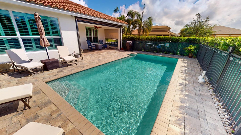 Photo of 9617 SW Royal Poinciana Drive, Port Saint Lucie, FL 34987 (MLS # R11120568)