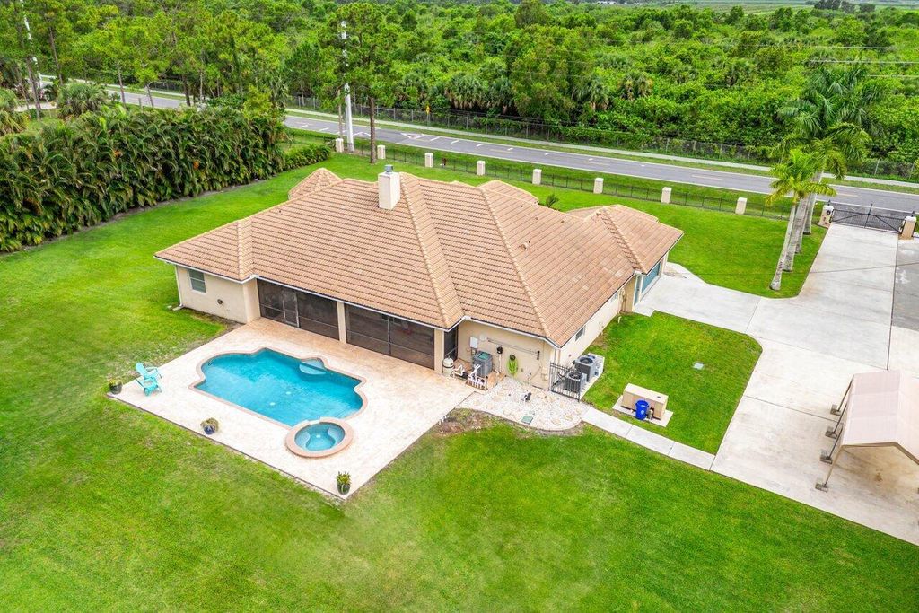 Photo of 18301 Hamlin Boulevard, The Acreage, FL 33470 (MLS # R11097443)