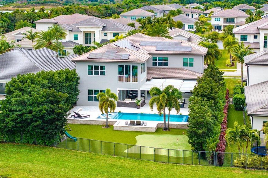 Rare opportunity to own the LARGEST home in Berkeley Boca Raton built by GL Homes, meticulously constructed and designed in 2018. This custom, Monterey model is exclusive to this address and is the only home in Berkeley with 6,000+ Living SF, putting it in a category of its own. This enormous estate features 5 en-suite bedrooms, 7 total bathrooms, an oversized bonus room, a home gym, spacious loft + a second-story private office (enclosed with hurricane impact sliders) off the primary suite with spectacular views of the resort-style backyard. The massive primary retreat offers 400+ SF of unparalleled convenience with TWO primary bathrooms + enormous his and hers, custom built walk-in closets!