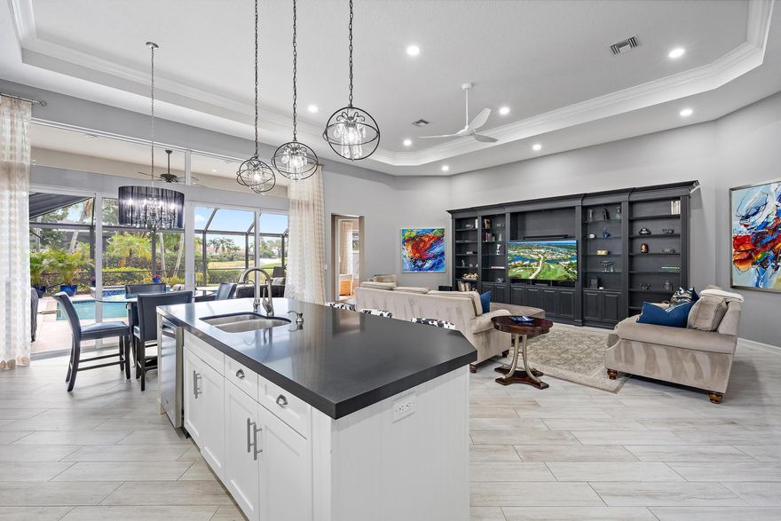 Renovated, refined, and exceptionally located in Villagio--just steps from the Club at Ibis-- this beautifully updated Portofino model offers the perfect blend of style, infrastructure upgrades, and an unbeatable setting. Positioned on the desirable Piazza across from the picturesque fountain, the residence enjoys a southern rear exposure overlooking the lush green of Tradition Course #17, capturing light, warmth, and tranquil golf views. Inside, the home has been thoughtfully transformed with all-new designer flooring throughout, including elegant porcelain tile and wood-look plank set on the diagonal, creating a cohesive and contemporary aesthetic. The popular 3BR/3BA+Den great room floor plan offers open, inviting living spaces ideal for both everyday comfort and entertaining. The kitchen has been reimagined with modern finishes, flowing seamlessly into the main living areas.

Over the past several years, the home has undergone extensive improvements, ensuring both beauty and peace of mind. Impact glass windows and doors throughout, a whole-house generator, and a new HVAC system provide security and efficiency. Additional upgrades include a new hot water heater, complete whole-home water filtration system with reverse osmosis in the kitchen, new washer and dryer, new disposal, and replaced central vacuum equipment.

Outdoor living has been elevated with brushed marble pavers on the pool deck, an upgraded lanai screen enclosure, and a new pool heater, all framed by a freshly painted exterior (2024). Interior paint was completed following installation of the impact glass, and custom Closet Wizard built-ins enhance storage throughout. The guest bathroom was beautifully renovated in August 2025, and both guest bedrooms feature new flooring. Even the details have been addressed, including a new garage door opener.

Villagio is known for its charm, walkability, and proximity to Ibis's world-class amenities. As a resident of The Club at Ibis, you'll enjoy access to a 90,000-square-foot clubhouse, three Nicklaus-family championship golf courses, five dining venues, a state-of-the-art fitness complex and spa, and premier tennis and pickleball facilities.