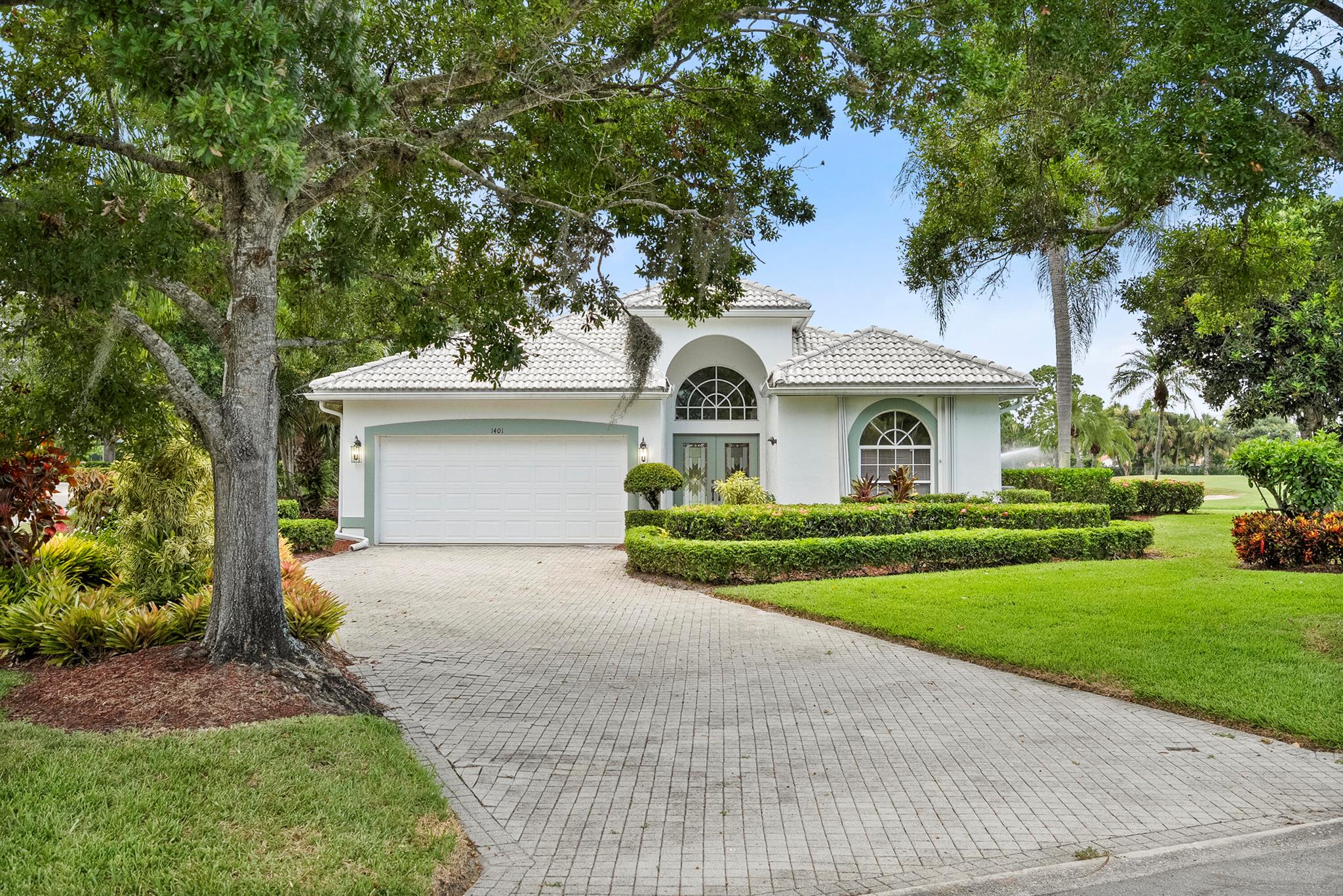 Soak in serene lake views with a backdrop of the golf course in this beautifully updated home in a luxury gated community. Featuring 3 bedrooms or 2 and an office, 2 full bathrooms, and a 2-car garage, the open floor plan is bright and airy with soaring ceilings, granite counters, stainless appliances, and neutral tile throughout. Roof installed in 2018, water heater in 2021 A/C in 2022. Enjoy the optional membership to the private golf and/or yacht club, plus a 23-acre nature preserve with scenic trails. Resort-style living with quick access to the new Port District in PSL and minutes from the mall and shopping in Jensen Beach.