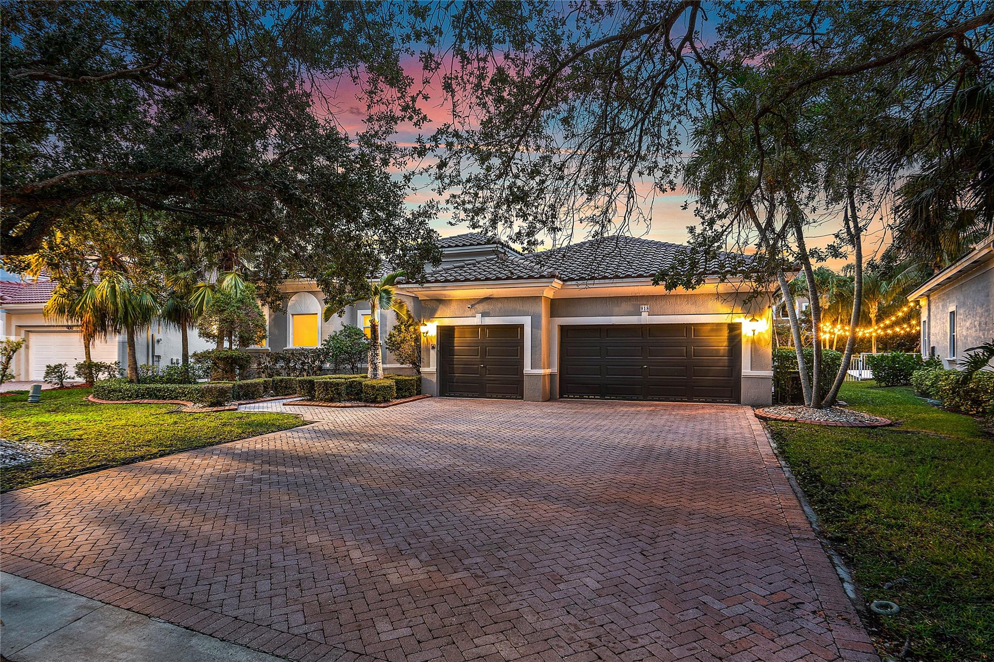 Welcome to this exquisite single story 5 bed, 3 bath Divinci model pool home in the sought-after gated community of Venetian Isles, Coral Springs. Featuring a desirable triple-split floor plan with soaring 12-ft ceilings, turnkey residence boasts a chef’s kitchen with custom wood cabinets, granite counters, oversized fridge, vegetable sink, pantry, and stainless appliances. Cherry wood floors in the office. Enjoy the luxurious master suite with dual bathrooms, bidet, and double shower. Crown molding, plantation shutters, closet organizers, a built-in computer nook, cabana bath, full hurricane protection, and a whole-house generator complete the package. Newer roof ('21), whole house reverse osmosis system, and a heated saltwater pool. This home is a gem! Close proximity to the Sawgrass.