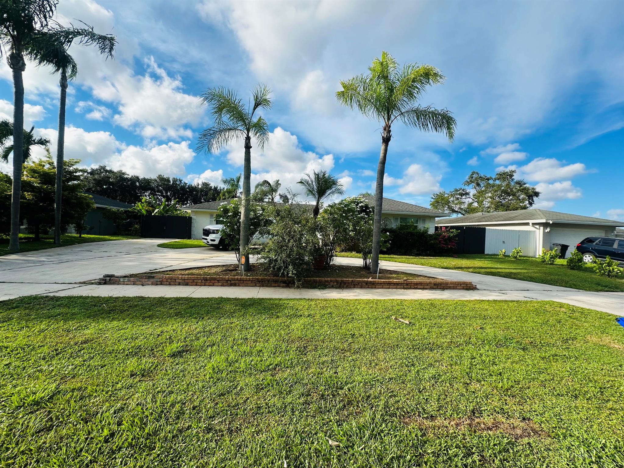 Looking for space, style, and functionality? This beautiful single-family home offers 1,800 square feet of comfortable living space, perfect for entertaining or relaxing with family.Outdoor Kitchen. Screenedd in patio- Ideal for weekend BBQs & entertaining. Expansive Driveway - Room for multiple vehicles, plus space for your boat or trailer. Elegant Interior - Tile and laminate wood flooring throughout! Grand Foyer - Welcome guests in style. Updated Kitchen - Featuring stainless steel appliances Modern Master Bath - Includes Bluetooth capability so you can enjoy music while you get ready! Fully fenced backyard - Perfect for pets or outdoor activities. Circular Driveway - Adds convenience and curb appeal. Lawn service NOT included. Schedule a tour today before it's too late!!