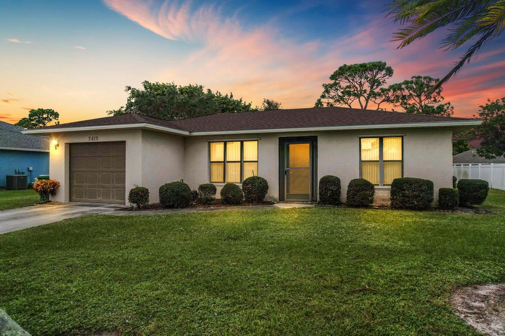 Photo of 2425 SE Rival Avenue, Port Saint Lucie, FL 34952 (MLS # R10937567)