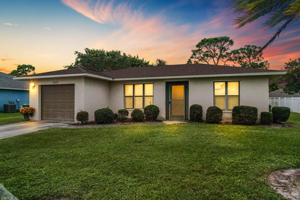 Photo of 2425 SE Rival Avenue, Port Saint Lucie, FL 34952 (MLS # R10937567)