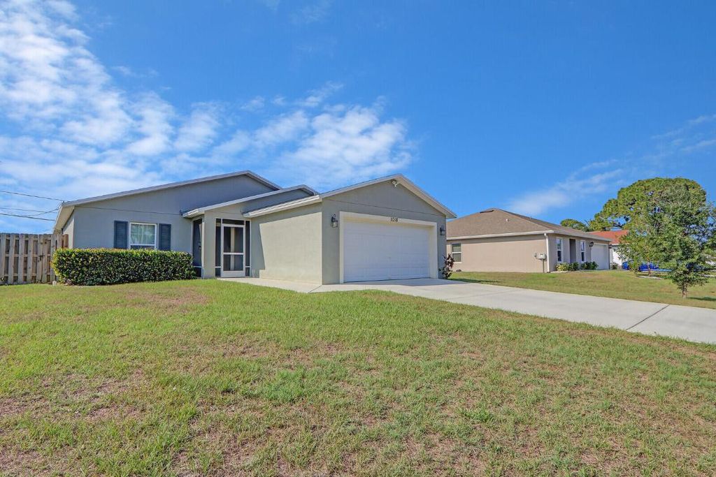 Photo of 1018 SW Coleman Avenue, Port Saint Lucie, FL 34953 (MLS # R10991488)
