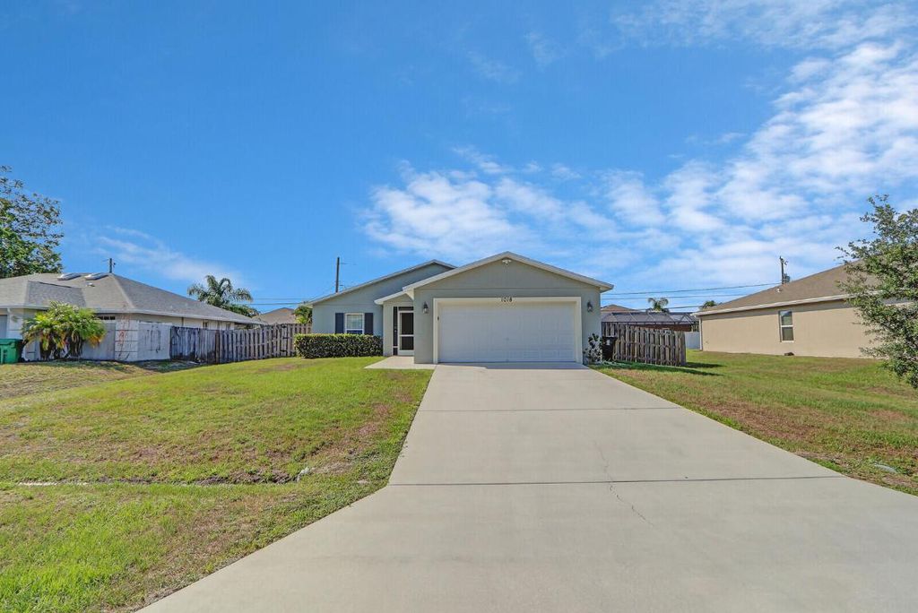 Photo of 1018 SW Coleman Avenue, Port Saint Lucie, FL 34953 (MLS # R10991488)