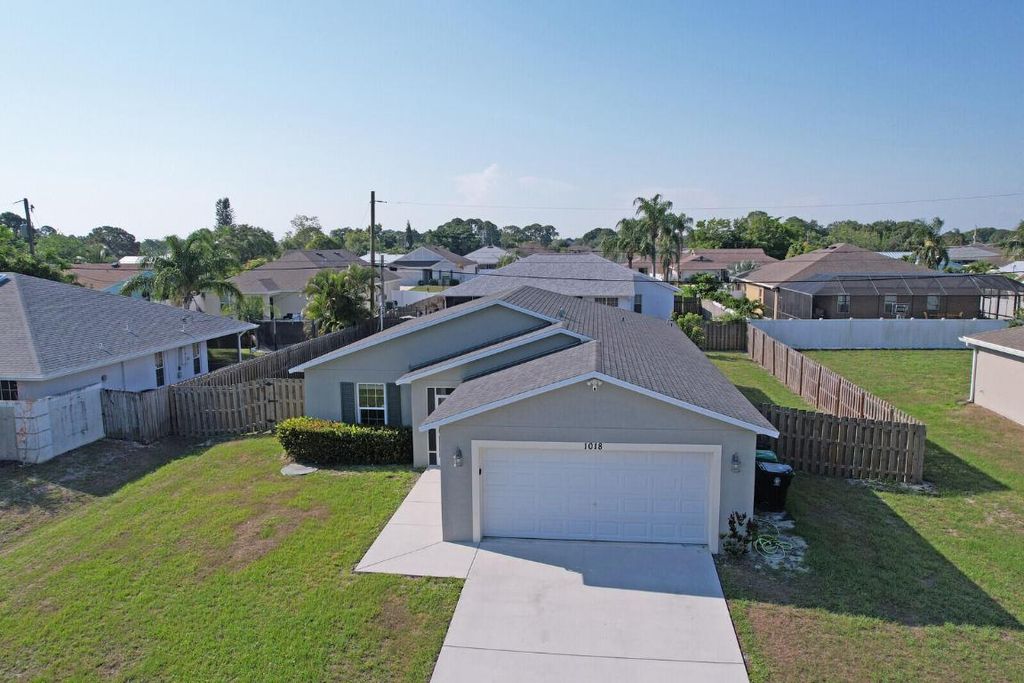 Photo of 1018 SW Coleman Avenue, Port Saint Lucie, FL 34953 (MLS # R10991488)