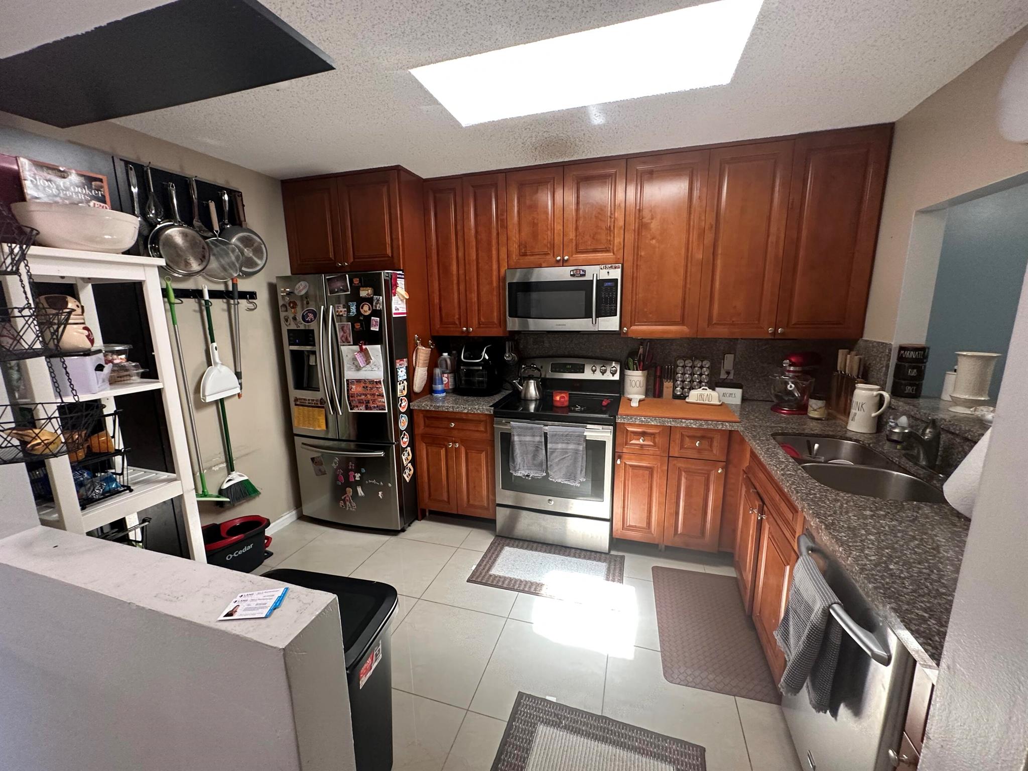 Wood laminate in all bedrooms, 20x20 tile in living areas, beautiful screened in patio off family room and master bedroom, washer and dryer in unit off patio. Bedrooms have ample closet space. All living on first floor. Community offers pool, basketball, racquetball, tennis and clubhouse in process of completely renovating. Roof 12/22, AC 2016, Nest, Ring Doorbell, Installed pull down attic with stairs. No lease first 2 years, 2 pets under 35 lbs/each. Association includes cable and all lawn maintenance.