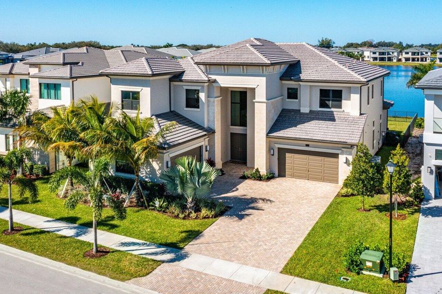 Breathtaking 2021 new construction dream home, situated on approximately 1/3 acre premium lot in the brand-new luxurious community of Boca Bridges! This open concept and designer appointed Riverside model includes 5 ensuite bedrooms, plus a clubroom (or 6th bedroom) & loft. Stunning white kitchen with huge quartz waterfall countertop island and upgraded Wolf/Subzero/Miele appliances. Primary bedroom is upstairs with two large custom walk-in closets, plus a huge walk-in frameless glass shower. All bedrooms have custom closets! Enjoy the covered veranda outside the primary bedroom and loft. Backyard features a heated pool/spa, builtin summer kitchen, and retractible electric screens! Builder 1-year warranty conveys to new owner from date of completion! Boca Bridges offers top-tier amenities.