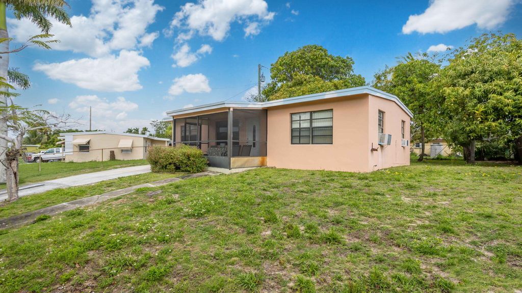 Photo of 131 Ficus Tree Drive, Lantana, FL 33462 (MLS # B26015049)