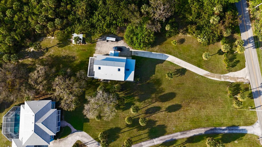 Photo of 13001 S Indian River Drive, Jensen Beach, FL 34957 (MLS # R10959778)