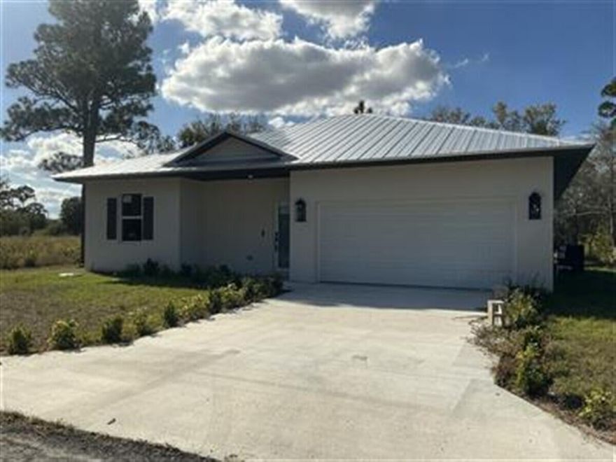 Welcome to new construction in the country on over 3/4 an acre! This Country abode offers all impact glass windows and doors with a metal roof, giving you the cheapest insurance rate! Amazing split 3-bedroom home with an open floor plan and covered back patio. All wood tile throughout the home. No nasty carpet! White shaker kitchen cabinetry with quartz countertops. Upgraded black hardware. This is your opportunity for an amazing home investment. No HOA. Bring your toys! Only 1 mile from Islamorada for fun weekend activities!