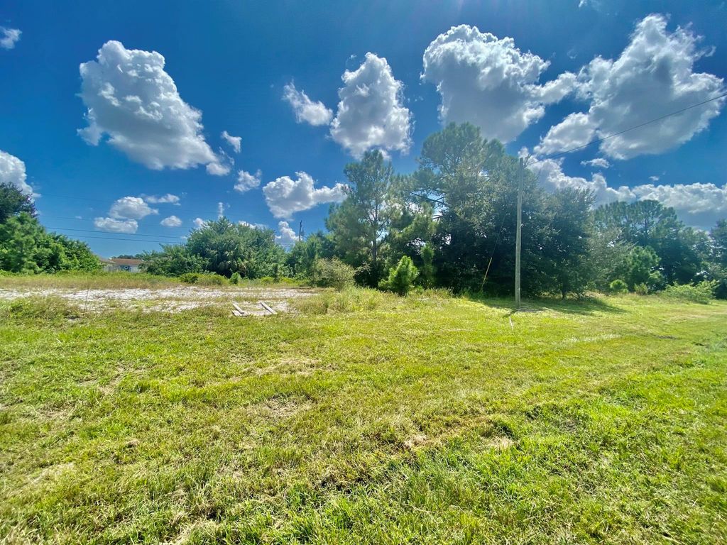 Photo of 4055 SW Port St Lucie Boulevard, Port St Lucie, FL 34953 (MLS # R10918078)