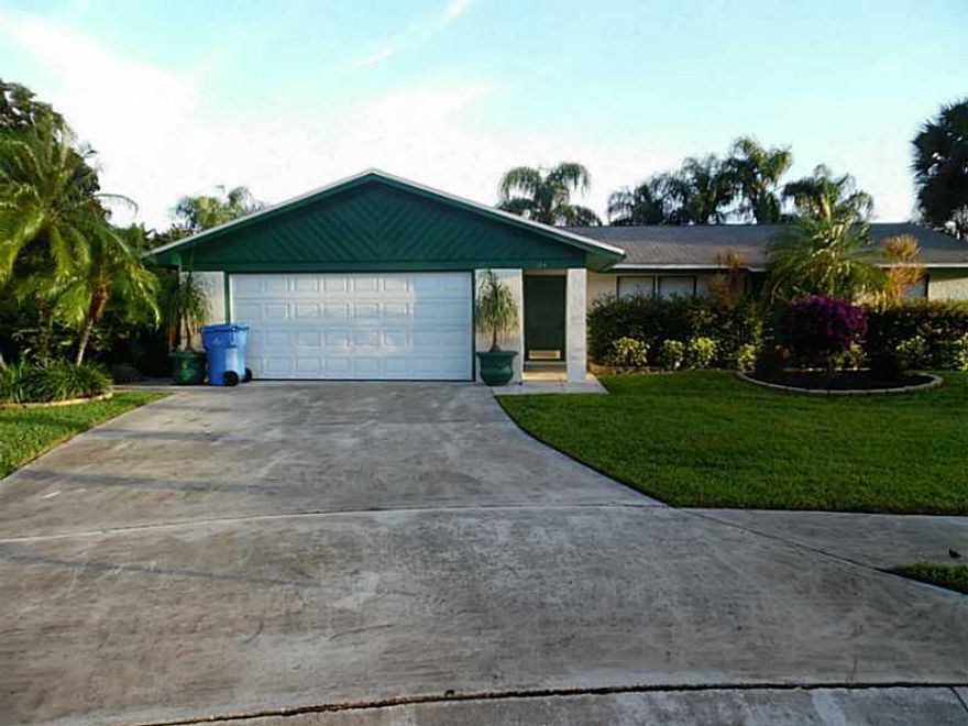 Another Professionally Managed Property located in Royal Palm Beach FL! Fantastic cul-de-sac lot home with Canal View, permitted dock and palm tree lined shore! 4 bedrooms 2 bathroom split floor plan featuring wood & tile flooring throughout. Updated Kitc hen with newer cabinets, granite counter tops, pantry, breakfast bar, and stainless steel appliance. Updated bathrooms, Large master suite with walk in closet. Tiled screened in patio with canal View in a beautiful community close to everything!!