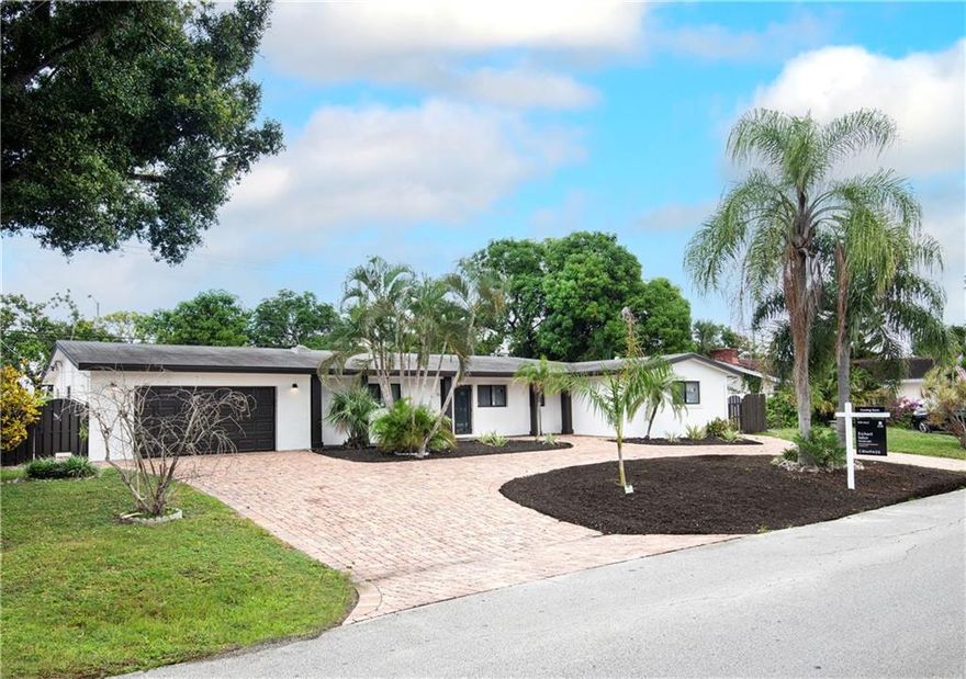 Presenting a newly completed contemporary masterpiece in Coral Ridge Isles totally renovated with permits. This stunning home is primed for those that love a modern design and the finer things in life.  You will be in awe as you enter the 1000 sq ft great room combining the kitchen, dining and living space adorned with a gorgeous rectified porcelain tile floor with marble look throughout. It offers a split layout with the spacious primary bedroom in the rear and sliding doors over looking the pool.  The secondary bedrooms are each a decent size with Jack 'n Jill set up.  As a bonus the 3rd bath is a cabana with access also from the garage.  The home has all new impact glass, updated plumbing and electric, new AC and ductwork, 2 tankless water heaters and all new appliances.