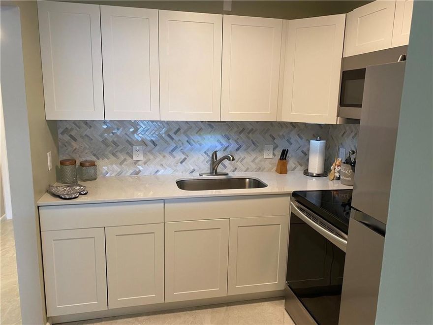 ANNUAL RENTAL AVAILABLE 04/20/2026 ...THIS ONE IS A DOLLHOUSE! QUIET AREA OF THE VILLAGE, SECOND FLOOR LOCATION IN A TWO STORY BUILDING. RECENTLY REMODELED! FULLY FURNISHED. KITCHEN HAS WHITE CABINETRY, STAINLESS STEEL APPLIANCES WITH A  GORGEOUS BACKSPLASH IN THE KITCHEN! COME LIVE THE GOOD LIFE!  CENTURY VILLAGE HAS RESORT STYLE AMENITIES TO INCLUDE A CLUBHHOUSE, INDOOR AND OUTDOOR POOLS, THEATER, RESTAURANT, TENNIS, PICKLEBALL, MINIATURE GOLF, CLUBS, COURTESY SHUTTLE AND SO MUCH MORE! DEERFIELD BEACH IS ABOUT 3.5  MILES AWAY,  ASSOCIATION CLAIMS 55+