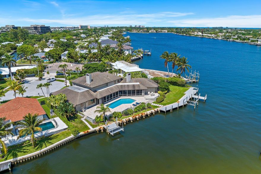 Rare opportunity offering 200' of deepwater frontage on one of North Palm Beach's most scenic lots!  This cul de sac home is located in HIDDEN KEY, a coveted private enclave East of US 1.   Custom built to feature organic design elements including true hardwood floors, plantation shutters, solid wood doors + pocket doors  Concrete Roof was replaced in 2011. Enjoy serene + secure living on Little Lake Worth (w/ easy Ocea n access). You can fish off your private dock! Water views from all main living areas. All bedrooms offer ensuite baths. Residents of North Palm Beach enjoy a newly renovated public country club w/ signature Jack Nicklaus golf, Olympic sized pool, fabulous tennis + wonderful indoor/outdoor dining overlooking the golf course. This home is just minutes to the best beaches, shopping, dining, educational and cultural venues.